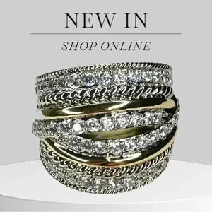Two Tone Cross Over Ring Simulated Stones